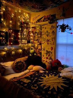 a bed room with a neatly made bed and many lights on the wall above it