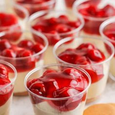 small cups filled with desserts sitting on top of a table