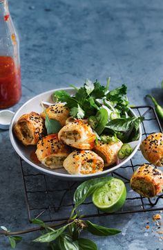 a white bowl filled with food on top of a metal rack