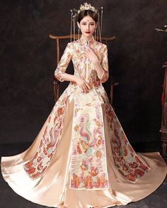 ⭐ Premium Handmade Item, High End Quality Gown; The very Elegant quality for Brides; ⭐ Item High Light: Classical Red Color; 4D Solid Tailor to Show Bride's Shape Beauty; Premium Satin Material Surface; Embroidery Golden Pattern盘金绣; Tassel jewelry decoration in front Chest and Sleeves/ Hemline; Tassel Satin with Pattern Skirt; Symmetrical Art design to show the beauty of Chinese Royal Wedding Fashion. ⭐ Made for Spring/Summer/ Autumn Season; Clothing Match Tips: Match to Loose Qipao Jacket/ High Embroidered Fitted Floor-length Wedding Dress, Traditional Wedding Dress With Long Train, Traditional Embroidered Dress For Banquet, Wedding Ao Dai In Pink With Floral Embroidery, Pink Ao Dai With Floral Embroidery For Wedding, Wedding Ao Dai With Pink Floral Embroidery, Wedding Pink Ao Dai With Floral Embroidery, Brocade Dress For Wedding And Festivals, Traditional Fitted Dress For Marriage