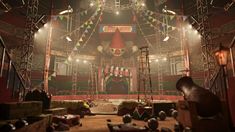 an empty circus stage is lit up with bright lights and decorations in the middle of it