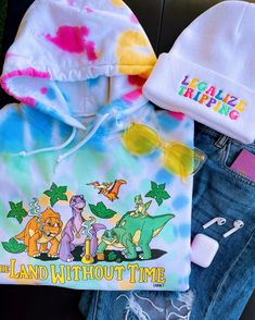 A fun, colorful hoodie perfect for all the tree star lovers out there! 🦕🌈 Model is wearing size medium. This hoodie is unisex and printed direct-to-garment on 80/20 super soft cotton and polyester. For maximum color vibrancy, turn inside out before washing & drying 🫧 Playful Cotton Hoodie With Graphic Print, Tie Dye Graphic Print Hoodie, Fun Winter Hoodie, Multicolor Cartoon Print Hooded Hoodie, Fun Cartoon Print Sweatshirt, Playful Multicolor Sweatshirt For Streetwear, Fun Cotton Hooded Hoodie, Fun Cotton Hoodie, Cute Multicolor Hooded Hoodie