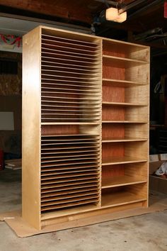 a large wooden bookcase in a garage