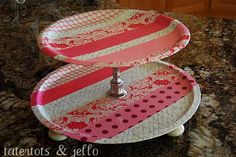 two tiered trays on top of a granite counter with polka dots and stripes