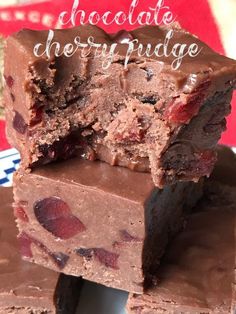 chocolate cherry fudge brownies stacked on top of each other with the words, chocolate cherry fudge above them