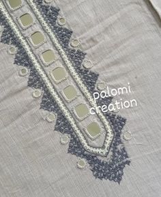 a close up of a piece of cloth with an embroidered design on it and the words palomi creation