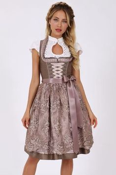 This Edirndl convinces with a noble design. Size braids and the beaded dirndl apron are the eye catcher! Each Dirndl is designed by our designers with great attention to detail. Our designers are inspired by the latest catwalk trends and incorporate them into their designs. The matching fabrics are selected, embroideries are drawn by hand and corset hooks are designed to match the fabric pattern. #edirndl #dirndl #dirndldresses #germandirndl #dirndlusa #traditionaldresses Dirndl Blouse, 50s Dresses, Skirt Length, Sleeveless Dress, Online Shop