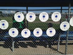 the baseball players are getting ready to hit the ball at the game in the batting cage