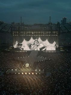 the stage is set up for a concert with lights on it and people in the audience