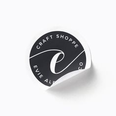 a black and white sticker with the words craft shoppe five all over it