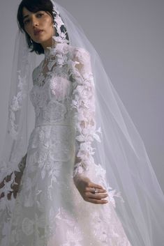 a woman wearing a wedding dress and veil