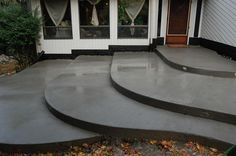 concrete steps with the words custom concrete stairways on it in front of a house