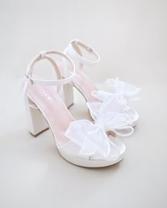 Satin platform block heel sandals accented with oversized layered organza bow for a sweet and romantic look. Elegance and classic inspired wear for your special day. Perfect for brides, bridesmaids, prom night, date night, and definitely a highlight on every special occasions.DETAILS:HEELS: 4 inchesCOLORS AVAILABLE: Ivory, White and Light BlueUPPER: Synthetic upper and liningMATERIALS: Manmade outsoleORIGIN: ImportedSTYLE NAME: ATHENA Aesthetic White Heels, Classy Heels, Wedding Platform, White High Heels, Cute Shoes Heels, Shoes Heels Classy, Bridal Shower Inspiration, Platform Block Heels