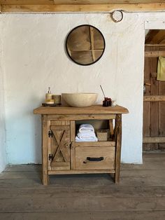 a bathroom with a sink and mirror on the wall