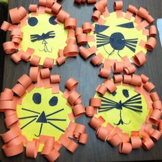 three lion crafts made out of construction paper