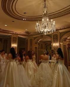 the bridesmaids are getting ready to go into their wedding gowns for the ceremony