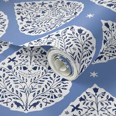 a blue and white wallpaper with an ornate design on it's surface,