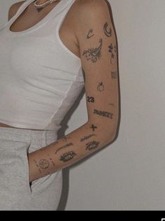 a woman with many tattoos on her arm