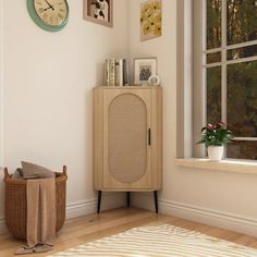 a room with a wooden cabinet and clock on the wall