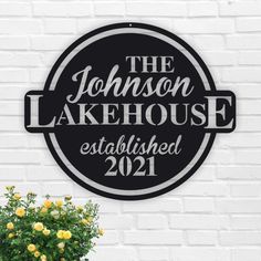 a black and white sign that says the johnson lakehouse established 2021