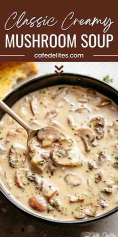 a pan filled with mushroom soup on top of a table next to bread and spoon