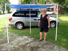 a woman standing in front of a car under a blue tent that says woohoo success