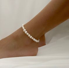 - Comes in 9 or 10 inches - Perfect for stacking on ankle or wearing individually - Ready Wear Quantity : 1 Piece Material : Freshwater Pearl, Beading Wire, Metal Clasp Size: 9 inch or 10 inch Surface : Smooth Please ask for larger quantities if would like more than what is currently listed! ★ Shop Bulk Discount Codes★ -Spend $50-$100 get 10% OFF Use Code: BEAD10 -Spend $101-$150 get 15% OFF Use Code: BEAD15 -Spend $151-$200 get 20% OFF Use Code: BEAD20 -Spend $201 and above get 25% OFF Use Code Adjustable White Pearl Anklets, Elegant Summer Anklets With Round Beads, Beaded Ankle Wrap Anklet, Adjustable Beaded Pearl Anklets, How To Wear Pearls, Pearl Ankle Bracelet, Cute Anklets, Pearl Beading, Charm Anklet