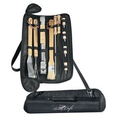 an assortment of cooking utensils in a black case with zippered pouch on white background