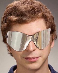 a man wearing a pair of silver goggles