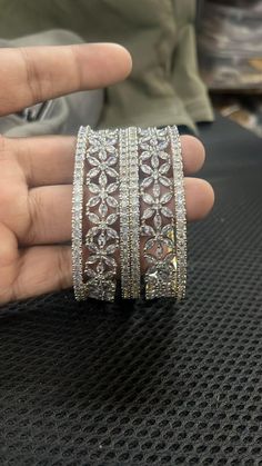 Ashura jewels beautiful wedding wear diamond bangle set this is a 6 pcs Kada bracelet silver polished bangle set this set is very easy to wear. we ship our items everywhere. Colour white design bangle stone Pearl beads  2.4,2.6,2.10,2.12 Size available These openable bangles can be wear by 2.8 size person.   material gold plated Standard shipping takes 3 to 4 weeks to deliver the parcel if a customer needs an item urgently then we can ship the item through Express shipping it takes 3 to 6 days t White Stone Bangles, Diamond Kada, Wedding Women, Bracelets Design, Stone Bangle, Indian Bollywood, Diamond Bangle, Pakistani Wedding, Bangle Set