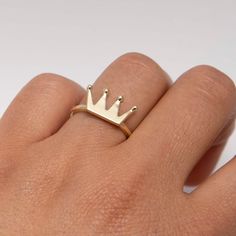 "Shiny Crown Ring Real 10K Yellow Gold * Metal : Real 10K Yellow Gold (Properly Stamped, 10K) * Condition : Brand New * Finish : Polished * Average Weight : 2.53 grams * Size : 6 * Width : 8.5mm x 15.5mm = Just over 1/4\" x 5/8\" * Clasp/Bail : Can be resized down or up at your local jeweler All of our items are brand new and are shipped with a gift box." Gold Ring With Crown Design For Anniversary, Gold Crown Shaped Promise Ring, 14k Gold Crown Design Anniversary Rings, Crown Shaped 14k Yellow Gold Jewelry, 14k Gold Crown Design Ring, 14k Gold Crown Design Fine Jewelry, 14k Gold Crown Design Diamond Ring, Gold Crown Design Diamond Ring In 14k Gold, 14k Gold Crown Design Jewelry As A Gift