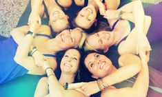 a group of women laying on top of each other in the middle of a circle