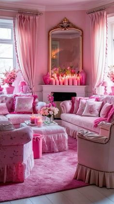 a living room with pink furniture and candles