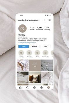 an instagram page on a bed with white sheets