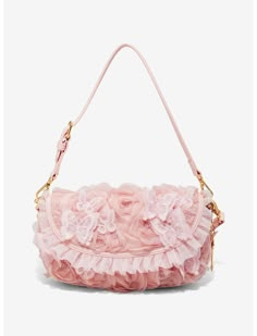 a pink handbag with flowers on the front and side, sitting on a white surface