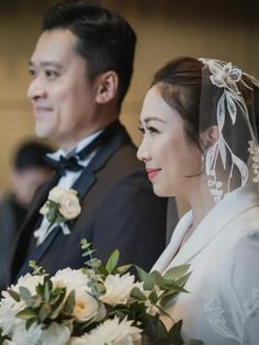 the bride and groom are looking at each other