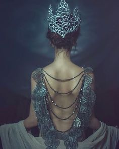 the back of a woman wearing a tiara