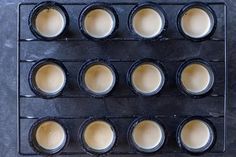 there are many cups in the pan ready to be cooked