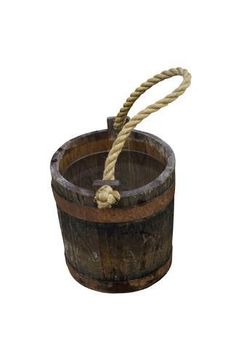 an old wooden bucket with rope attached to it