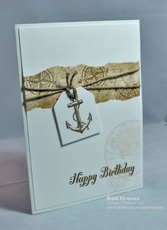 a happy birthday card with an anchor and ribbon on the tag that says happy birthday