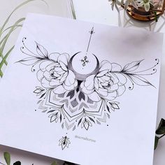 a drawing of flowers and an arrow on paper