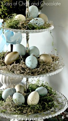 three tiered tray with eggs and moss