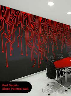 a room that has a red wall and black walls with computer circuit designs on it