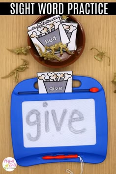 the sight word practice game give is displayed in front of a bowl with dinosaurs and other items