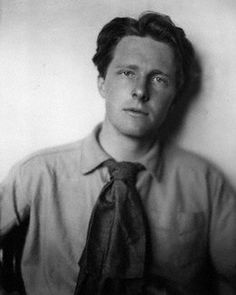 an old black and white photo of a man wearing a tie