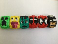 a row of knitted wristbands with cartoon characters on them