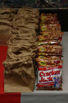 bags of crackers are lined up on a table