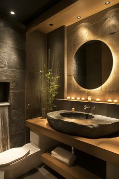 a bathroom with a sink, toilet and mirror in it's centerpieces