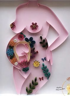 a paper cut out of a woman's body with flowers and butterflies on it