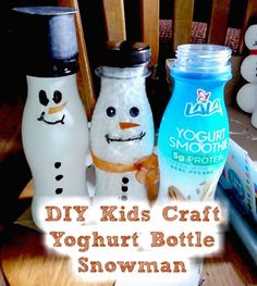 three snowmen made out of milk bottles sitting on a table with the words diy kids craft yogurt bottle snowman